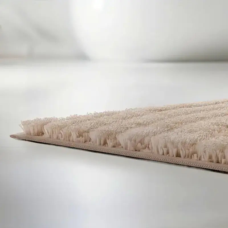 Badteppich Caffi in Beige – Detailansicht weicher Hochflor-Badematte
