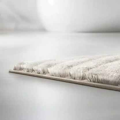 Badteppich Caffi in Natur – Detailansicht weicher Hochflor-Badematte
