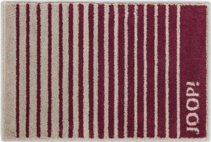 Fluschiger Badteppich "Shutter" von Joop: Der pflegeleichte und hochwertige Badezimmerteppich in Rouge ist ein stilvoller Teppich.