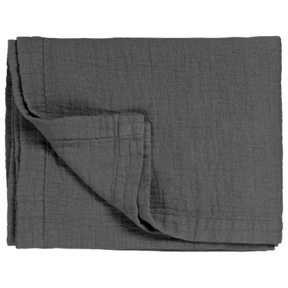 Tagesdecke Vandyck Pure 68 in Anthrazit, gefaltet mit feiner Webstruktur, breitem Saum und umgeschlagener Ecke

