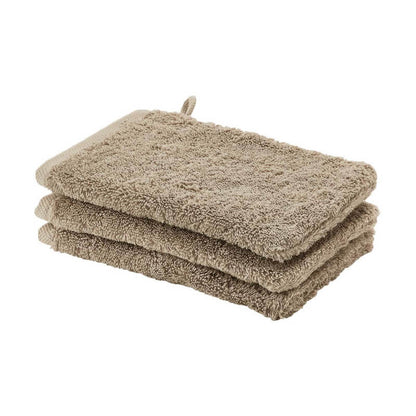 Hochwertige Baumwoll-Waschhandschuhe von Aquanova London (Almond) – ideal für sanfte Pflege.